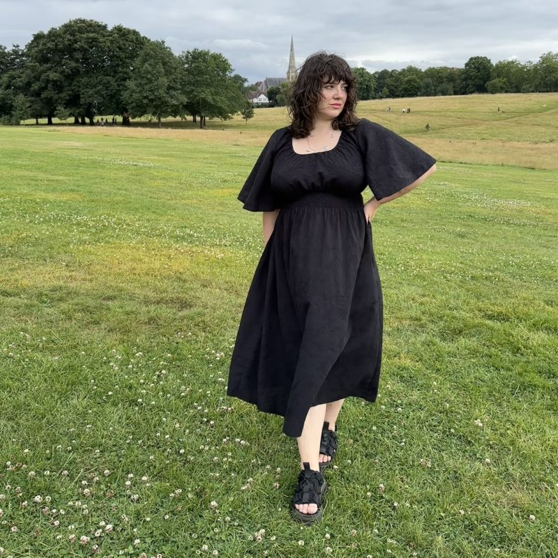 black cotton dress with 70s bell sleeves