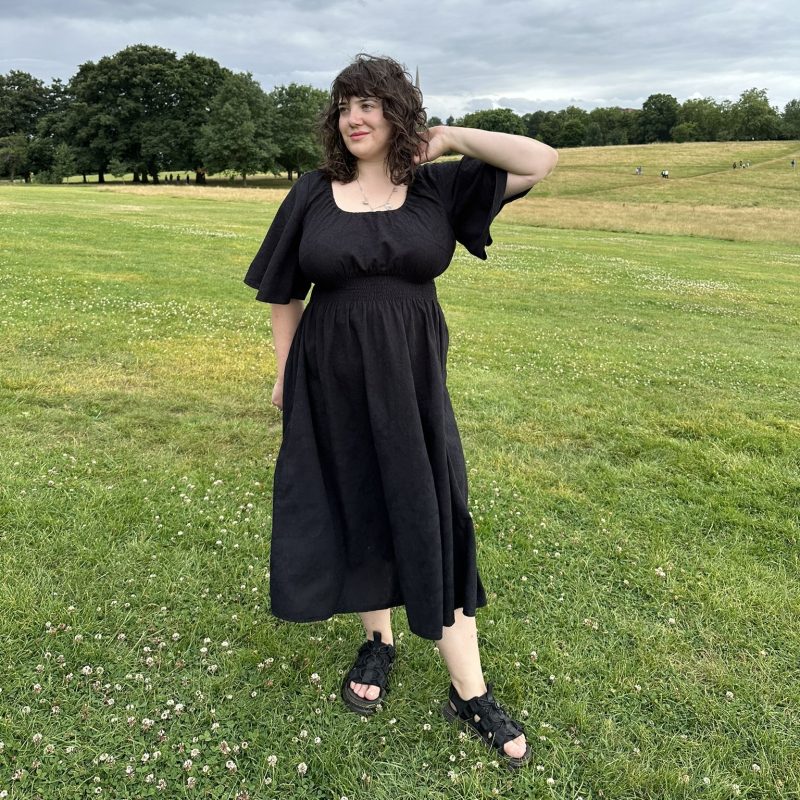 black cotton dress with 70s bell sleeves