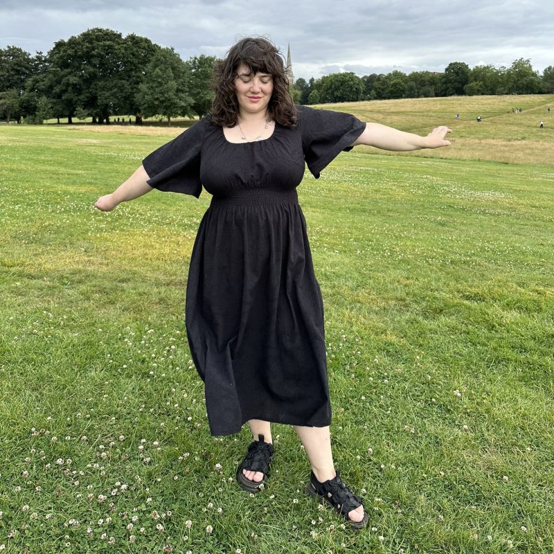 black cotton dress with 70s bell sleeves