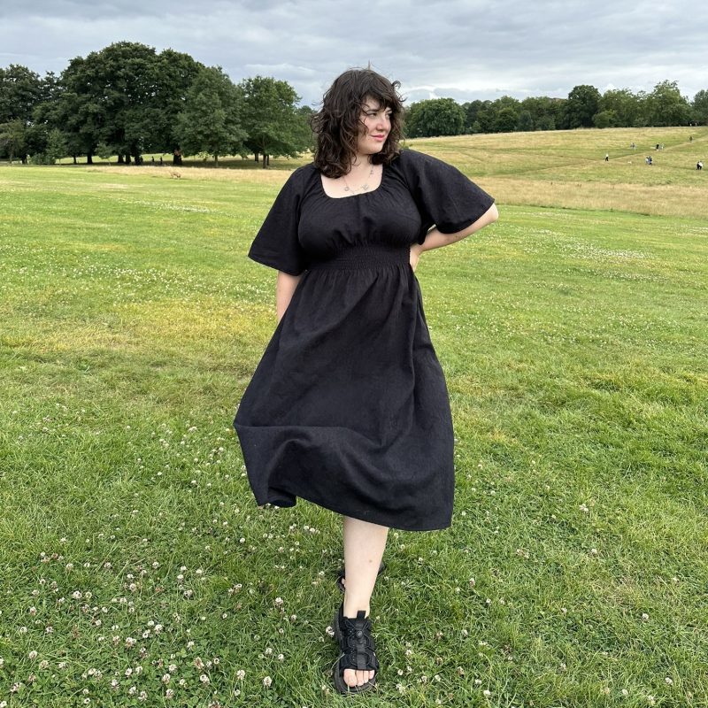 black cotton dress with 70s bell sleeves